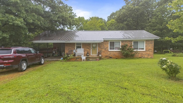 117 Hill Rd, Ardmore, TN 38449 - single story home featuring a front lawn, brick siding, a metal roof, a porch, and a carport