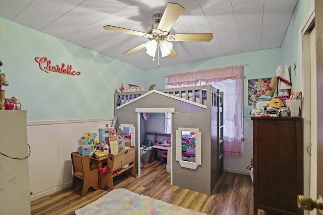 117 Hill Rd, Ardmore, TN 38449 - bedroom featuring wood finished floors, wainscoting, and ceiling fan