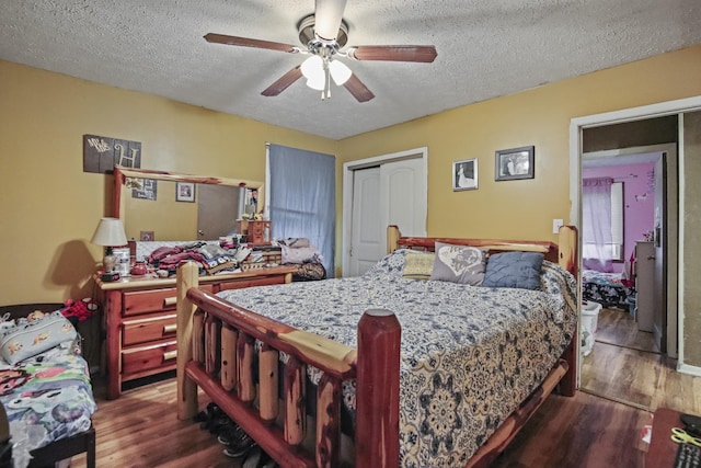 117 Hill Rd, Ardmore, TN 38449 - bedroom featuring wood finished floors, a textured ceiling, a closet, and a ceiling fan