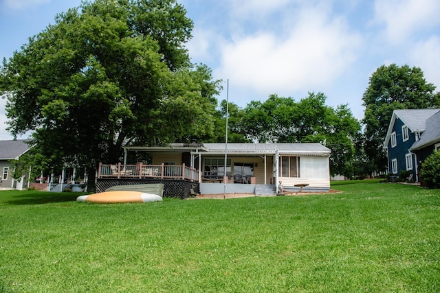 4295 Cairo Bend Rd, Lebanon, TN 37087 - rear view of property with a lawn, a wooden deck, a sunroom, and a metal roof