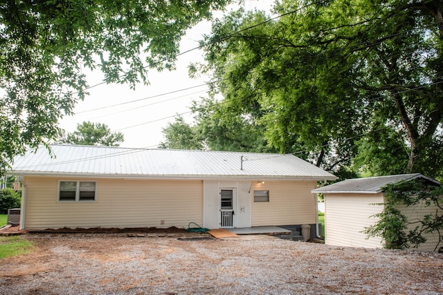 4295 Cairo Bend Rd, Lebanon, TN 37087 - rear view of property with a metal roof and a storage shed