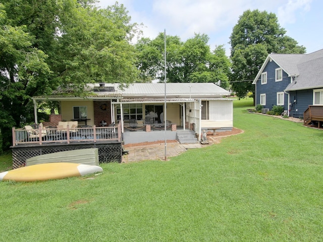4295 Cairo Bend Rd, Lebanon, TN 37087 - back of house with a yard, a wooden deck, and brick siding