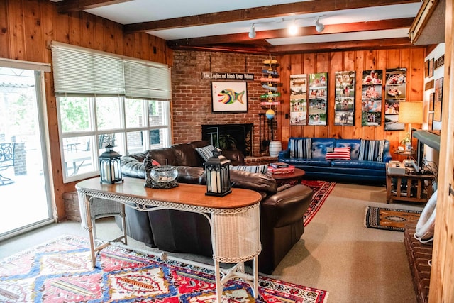 4295 Cairo Bend Rd, Lebanon, TN 37087 - living area with wood walls, beam ceiling, a brick fireplace, and carpet