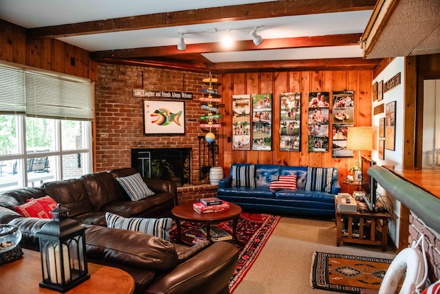 4295 Cairo Bend Rd, Lebanon, TN 37087 - carpeted living area featuring wood walls, beamed ceiling, and a fireplace