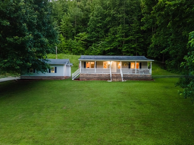 5719 Minor Hill Hwy, Goodspring, TN 38460 - view of front facade with a porch, a front lawn, and a view of trees