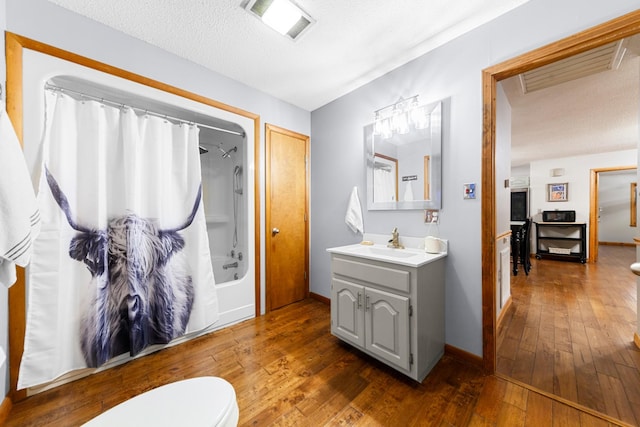 5719 Minor Hill Hwy, Goodspring, TN 38460 - full bathroom with vanity, wood-type flooring, shower / tub combo with curtain, and a textured ceiling