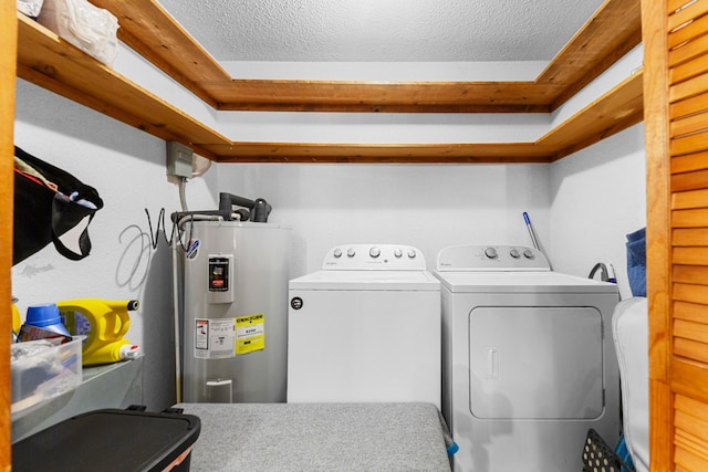 5719 Minor Hill Hwy, Goodspring, TN 38460 - laundry area with water heater, washing machine and dryer, and a textured ceiling