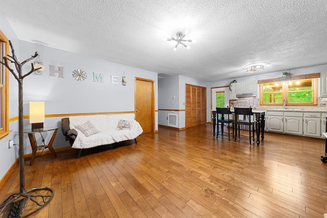 5719 Minor Hill Hwy, Goodspring, TN 38460 - living room featuring a textured ceiling and light wood finished floors