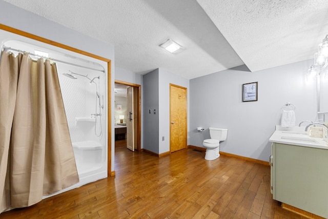 5719 Minor Hill Hwy, Goodspring, TN 38460 - full bathroom featuring a textured ceiling, vanity, wood finished floors, and a shower with curtain