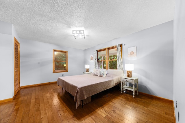 5719 Minor Hill Hwy, Goodspring, TN 38460 - bedroom featuring hardwood / wood-style floors and a textured ceiling