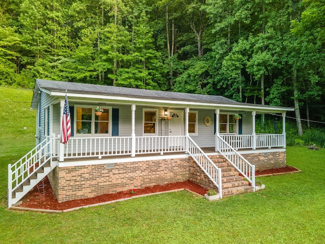 5719 Minor Hill Hwy, Goodspring, TN 38460 - ranch-style home with a porch, a front yard, stairway, and a view of trees
