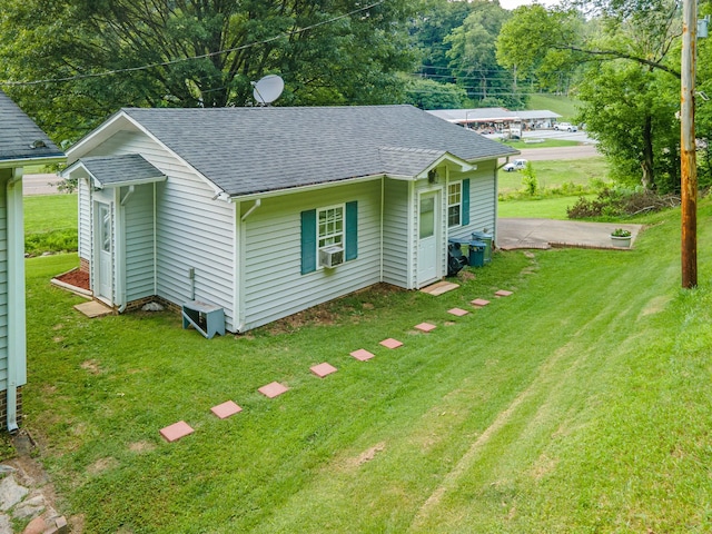 5719 Minor Hill Hwy, Goodspring, TN 38460 - view of front of home featuring roof with shingles, a front lawn, and cooling unit
