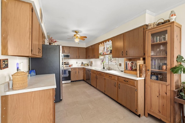 1409 E Northfield Blvd, Murfreesboro, TN 37130 - kitchen featuring appliances with stainless steel finishes, a ceiling fan, light countertops, ornamental molding, and brown cabinetry