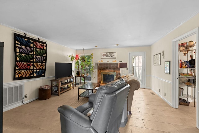 1409 E Northfield Blvd, Murfreesboro, TN 37130 - living room with light tile patterned floors, ornamental molding, a brick fireplace, and wainscoting