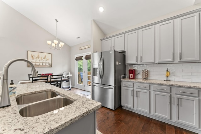 10005 Wendy Way, Lyles, TN 37098 - kitchen featuring stainless steel fridge with ice dispenser, gray cabinets, dark wood finished floors, backsplash, and decorative light fixtures