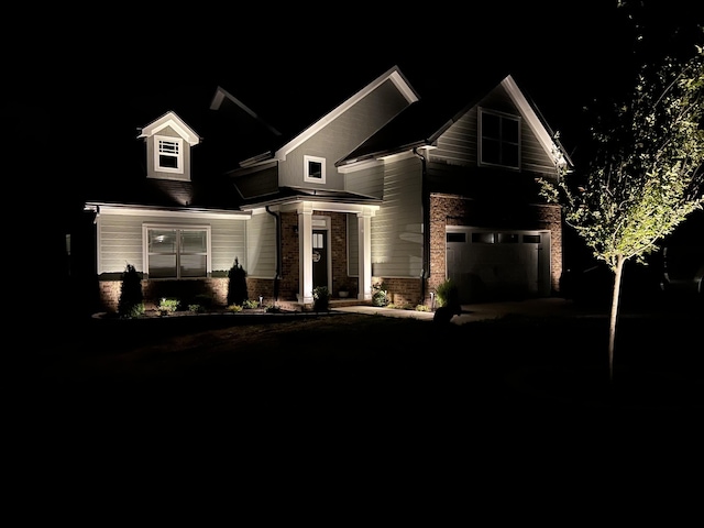 10005 Wendy Way, Lyles, TN 37098 - view of front facade featuring an attached garage, driveway, and brick siding