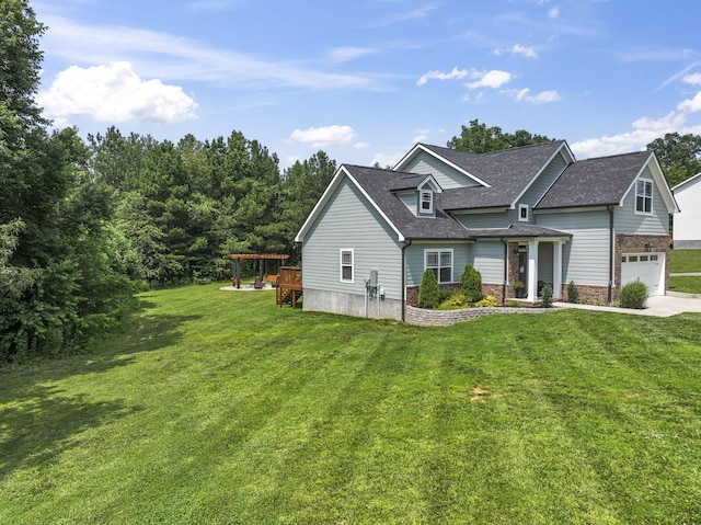 10005 Wendy Way, Lyles, TN 37098 - view of front of property featuring a front yard, roof with shingles, brick siding, driveway, and an attached garage