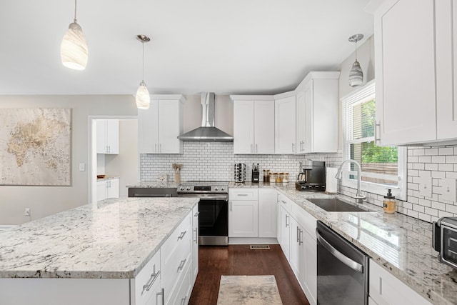 418 Winfrey Dr, Murfreesboro, TN 37130 - kitchen with wall chimney exhaust hood, appliances with stainless steel finishes, dark wood-style flooring, and white cabinets
