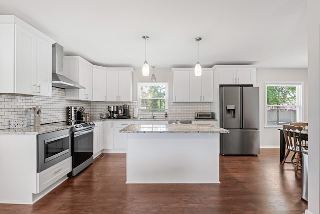 418 Winfrey Dr, Murfreesboro, TN 37130 - kitchen featuring appliances with stainless steel finishes, wall chimney range hood, plenty of natural light, and decorative backsplash