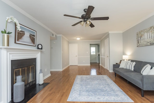 217 Ellington Pl, Madison, TN 37115 - living area featuring wood finished floors, a ceiling fan, ornamental molding, and a fireplace with flush hearth