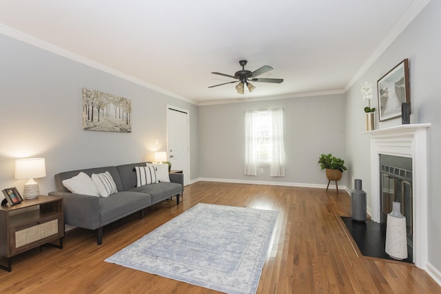 217 Ellington Pl, Madison, TN 37115 - living room with ornamental molding, wood finished floors, ceiling fan, and a fireplace with flush hearth