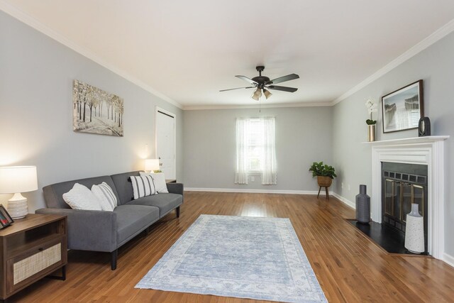 217 Ellington Pl, Madison, TN 37115 - living room featuring ornamental molding, wood finished floors, a ceiling fan, and a fireplace with flush hearth