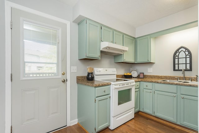 217 Ellington Pl, Madison, TN 37115 - kitchen featuring white range with electric stovetop, under cabinet range hood, dark wood-style floors, and green cabinetry