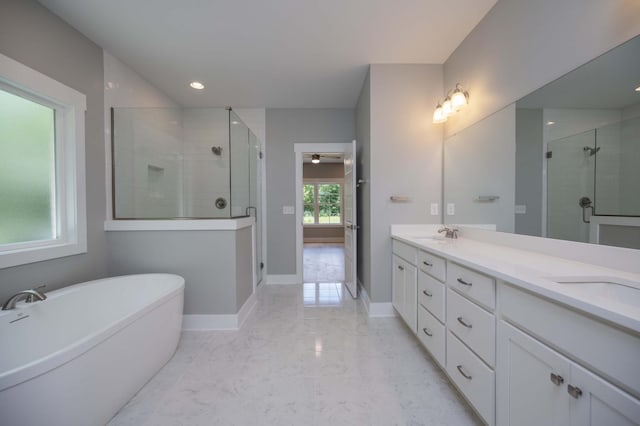 11497 Karo Rd, Bell Buckle, TN 37020 - bathroom with marble tiled flooring, a shower stall, double vanity, a soaking tub, and recessed lighting