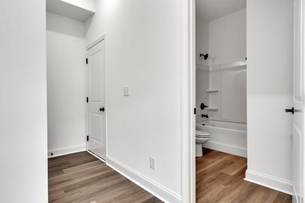 191 Charleston Ave, Pleasant View, TN 37146 - hallway with wood finished floors and baseboards