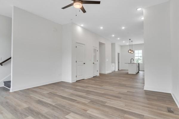 191 Charleston Ave, Pleasant View, TN 37146 - unfurnished living room with a ceiling fan, light wood-style flooring, and recessed lighting