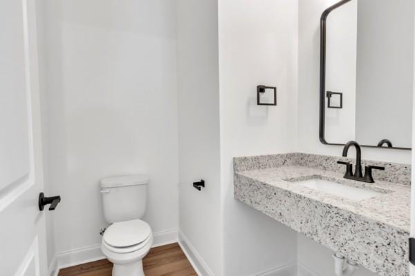 191 Charleston Ave, Pleasant View, TN 37146 - half bath with a sink and wood finished floors