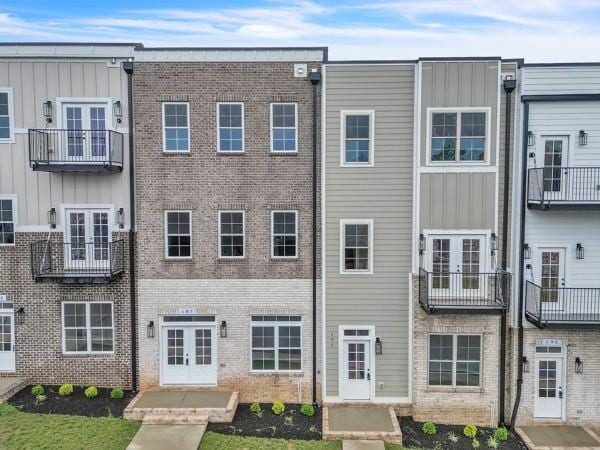 191 Charleston Ave, Pleasant View, TN 37146 - view of front of home with french doors, board and batten siding, and brick siding