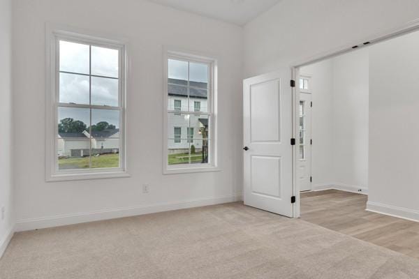 199 Charleston Ave, Pleasant View, TN 37146 - spare room featuring light colored carpet and baseboards