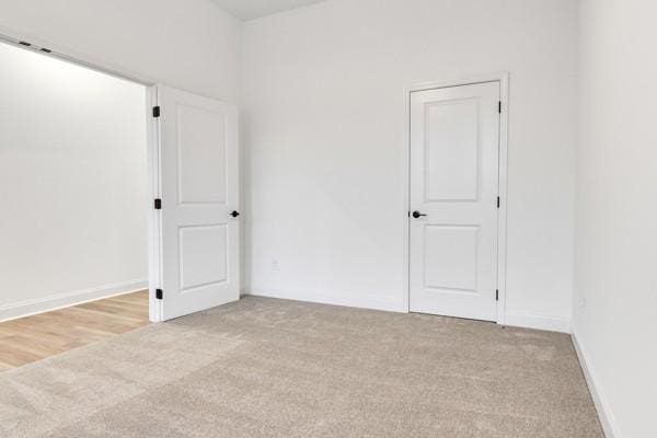 199 Charleston Ave, Pleasant View, TN 37146 - unfurnished bedroom with light carpet and baseboards