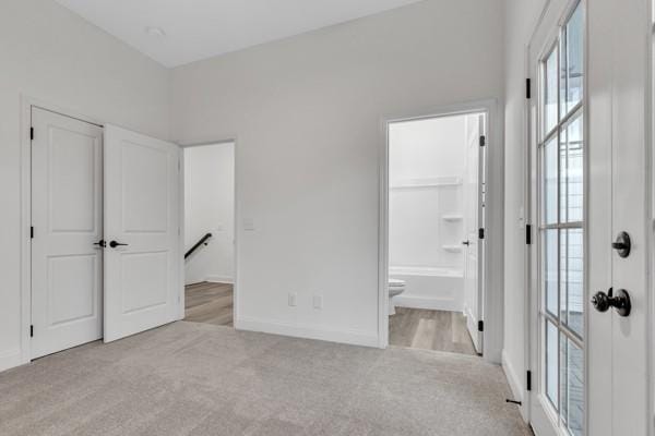 199 Charleston Ave, Pleasant View, TN 37146 - unfurnished bedroom with light colored carpet and ensuite bath