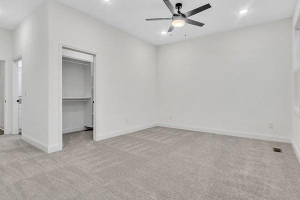 199 Charleston Ave, Pleasant View, TN 37146 - unfurnished bedroom featuring carpet floors, recessed lighting, a walk in closet, a closet, and a ceiling fan