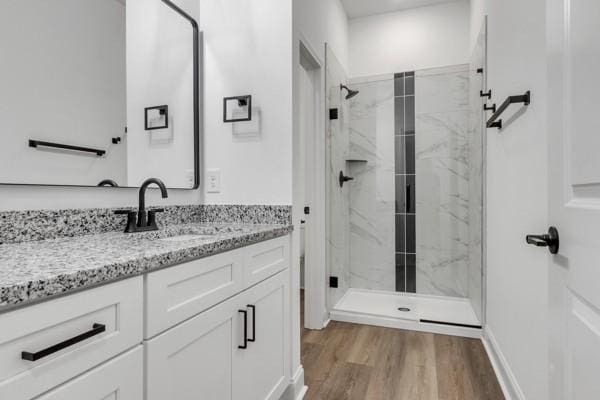 199 Charleston Ave, Pleasant View, TN 37146 - full bathroom featuring vanity, a marble finish shower, and wood finished floors