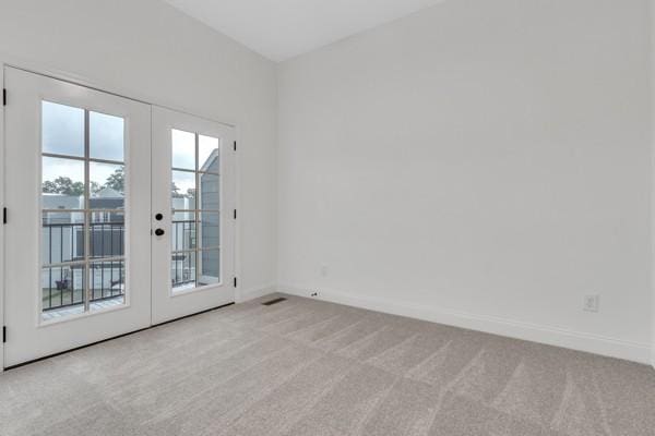 199 Charleston Ave, Pleasant View, TN 37146 - empty room with french doors and light carpet
