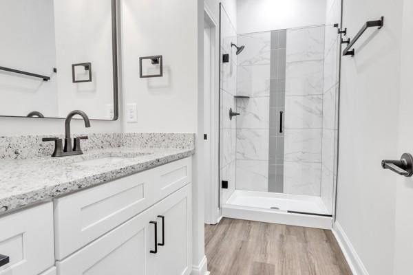 195 Charleston Ave, Pleasant View, TN 37146 - full bath featuring a marble finish shower, vanity, and wood finished floors