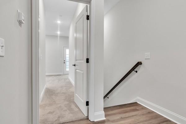195 Charleston Ave, Pleasant View, TN 37146 - hallway featuring an upstairs landing and baseboards