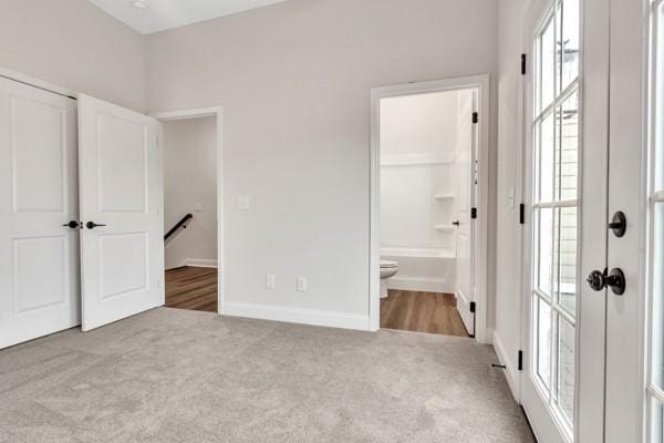 195 Charleston Ave, Pleasant View, TN 37146 - unfurnished bedroom featuring carpet flooring, multiple windows, ensuite bath, and a closet