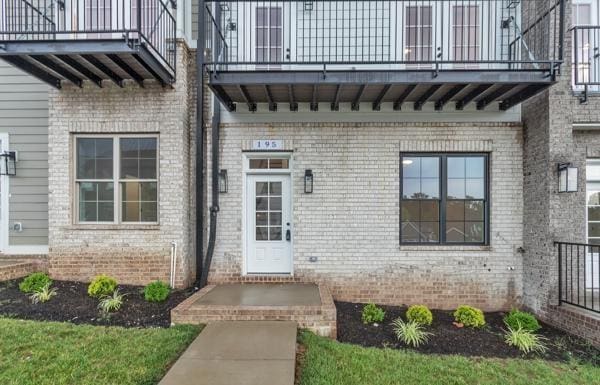 195 Charleston Ave, Pleasant View, TN 37146 - property entrance featuring a balcony and brick siding