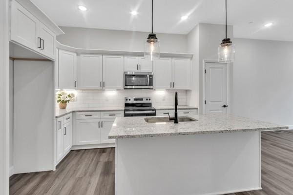195 Charleston Ave, Pleasant View, TN 37146 - kitchen with appliances with stainless steel finishes, dark wood-type flooring, white cabinets, and recessed lighting