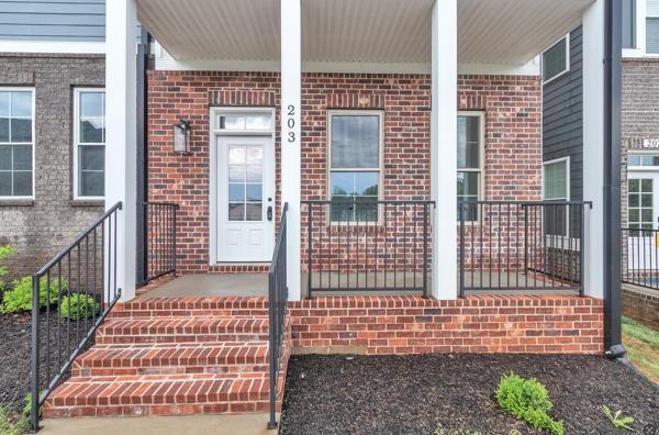 203 Charleston Ave, Pleasant View, TN 37146 - property entrance featuring brick siding and covered porch