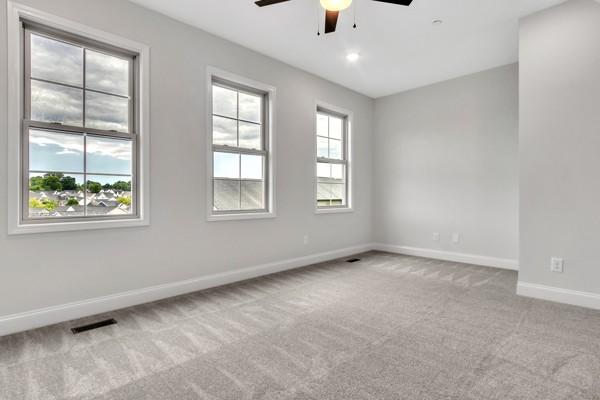 203 Charleston Ave, Pleasant View, TN 37146 - empty room with a ceiling fan and carpet flooring