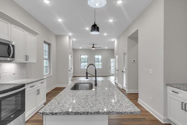 203 Charleston Ave, Pleasant View, TN 37146 - kitchen featuring stainless steel appliances, a ceiling fan, dark wood-style flooring, white cabinets, and recessed lighting