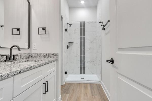 203 Charleston Ave, Pleasant View, TN 37146 - bathroom featuring vanity, a marble finish shower, wood finished floors, and recessed lighting