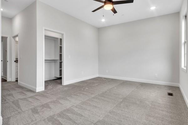203 Charleston Ave, Pleasant View, TN 37146 - unfurnished bedroom with carpet, a spacious closet, a closet, recessed lighting, and a ceiling fan
