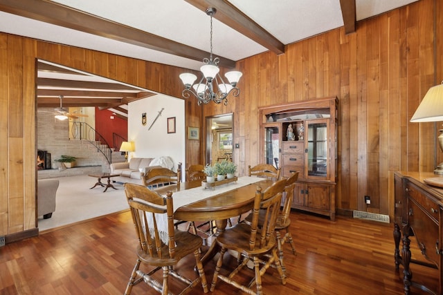 305 Myers Ter, Carthage, TN 37030 - dining space featuring wooden walls, beam ceiling, wood finished floors, stairs, and ceiling fan