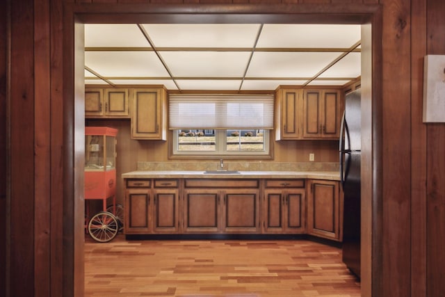 305 Myers Ter, Carthage, TN 37030 - kitchen with light countertops, light wood-style floors, and brown cabinetry